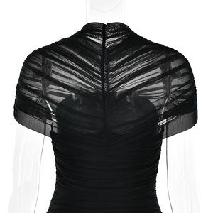 Detail of black sheer mesh bodysuit featuring intricate pleated texture and soft fabric
