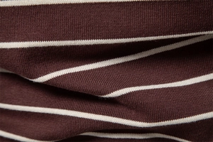Macro shot of striped knit fabric in coffee and beige showing detailed cozy wool texture