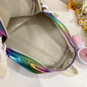 Iridescent laser backpack for students showing spacious interior with creamy white lining
