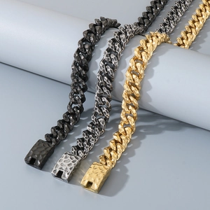 Macro detail of hammered texture Cuban bracelets in black, silver, and gold steel