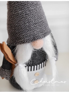 Macro detail of Christmas gnome showing knit hat texture and soft plush beard
