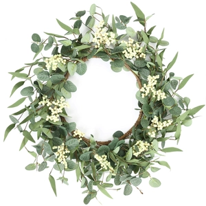 Eucalyptus berry wreath with grey-green leaves and white berries on a natural vine base
