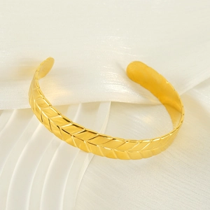 Adjustable gold stainless steel open bangle with elegant wheat grain texture on silk base