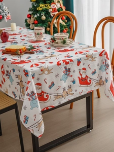Nordic Christmas tablecloth featuring Santa and reindeer pattern in a cozy festive setting
