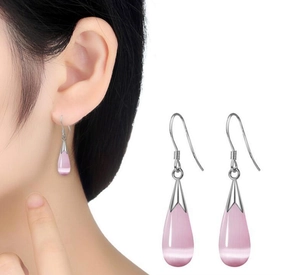 Detailed view of pink teardrop cat's eye stone earrings with silver hooks for women
