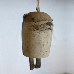 Handmade resin otter wind chime with rustic clay texture for bohemian garden decoration