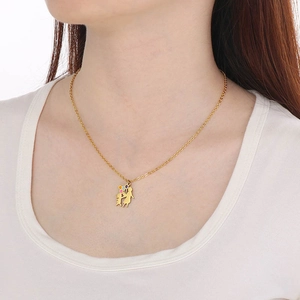 Detail view of 18K gold necklace showing mother and child with balloons on a model