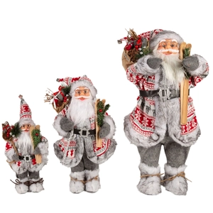 Three plush Santa Claus figures with Nordic grey sweaters and wooden skis on white background