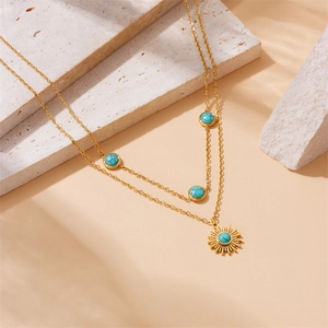 Double-layered gold stainless steel necklace with sun pendant and turquoise stone insets