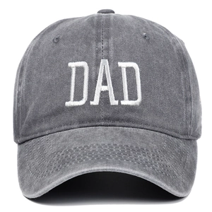 Close-up of DAD embroidery on dark grey washed cotton baseball cap with vintage texture