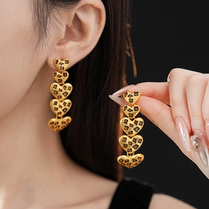 Golden heart drop earrings with leopard print pattern and vintage matte metallic finish