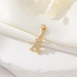 14K gold plated Eiffel Tower pendant with sparkling zircon on white silk background