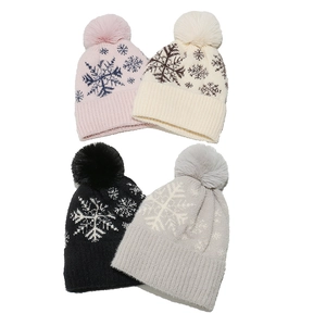Fleece lined winter knit hat with pom-pom and snowflake patterns in 4 colors