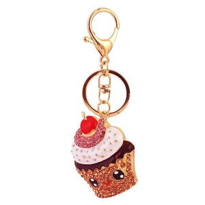 Sparkling pink rhinestone cupcake keychain with gold plating and red cherry charm
