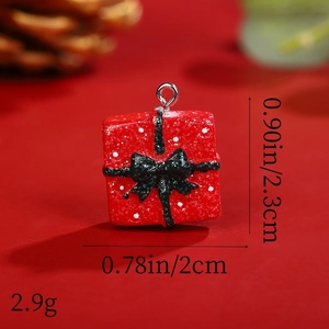 Macro view of Christmas gift box resin pendant with glitter bow and size dimensions