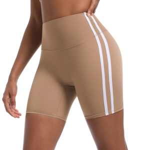 Close-up of khaki high-waisted yoga shorts with side white stripes for athletic wear