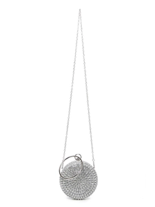 Detail of silver rhinestone evening clutch with round metal handle and delicate chain