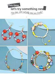 Macro shot of colorful glass plum blossom beads set with handmade floral jewelry details