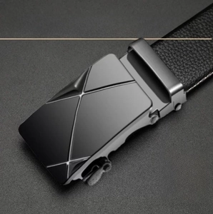 Detail of men's black business belt with geometric X-pattern metal buckle and lychee leather