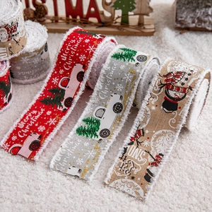 Linen Christmas ribbons with Merry Christmas prints on soft white plush background
