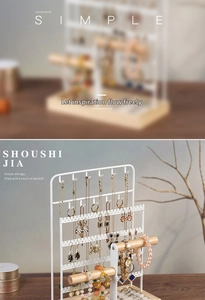 Detail of multi-tier jewelry organizer with wooden rod, earring holes and velvet ring tray