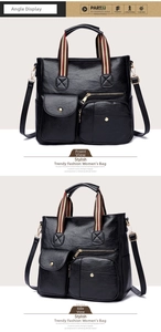 Detail view of large multi-pocket black leather crossbody bag with striped handle