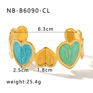 Detail view of colorful enamel heart bangle in gold finish with 6.3cm inner diameter