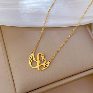 Minimalist titanium steel swan necklace in gold finish on a refined gift box