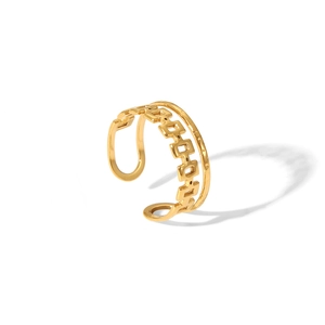 Detail of gold crown ring featuring geometric open chain design and polished finish