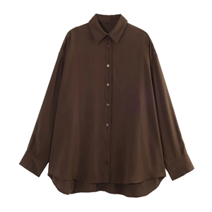 Flat lay of brown long sleeve shirt with loose fit curved hem and button-down collar