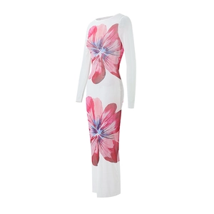 Detailed view of sheer mesh dress with large pink floral prints on white long sleeve fabric