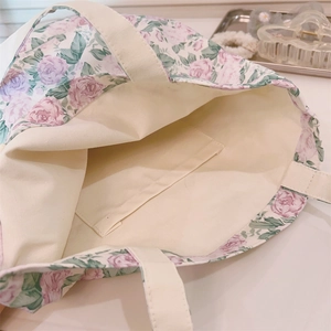 Detailed interior of floral canvas tote bag featuring an open inner pocket and thick lining