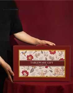 Deep red ceramic dinnerware gift box with floral design and double-layer packaging