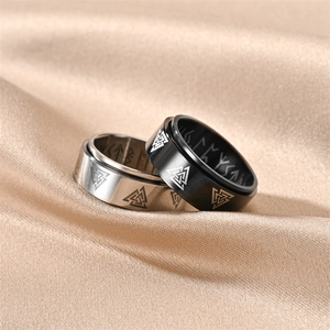 Anillos vikingos giratorios en plata y negro con símbolos Valknut y runas en seda