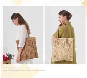 Detail of woven straw tote bags in beige and brown with leather handles and cross-stitch