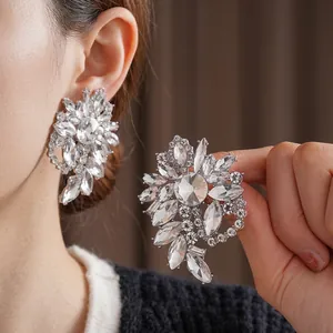Elegant silver geometric heart earrings with sparkling crystals for a luxury party look