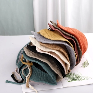 Foldable knit bucket hats in multiple colors with chin straps on a clean white background