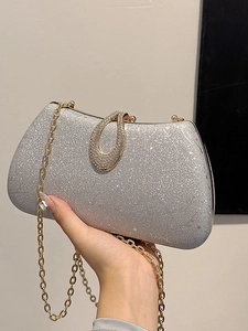 Silver glitter evening clutch bag with sparkling rhinestone U-buckle and gold chain strap