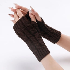 Detail of dark brown cable-knit arm warmers showing texture and fingerless design