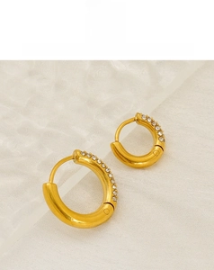 Detailed close-up of 18K gold-plated stainless steel hoop earrings with white zircons