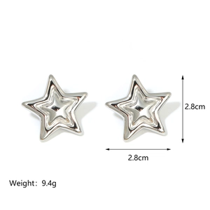 Detail view of 18K gold and silver star earrings with 2.8cm size and 9.4g weight specs