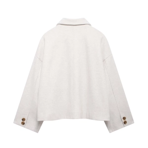 Back view of minimalist cream short woolen jacket with lapel and drop shoulder design