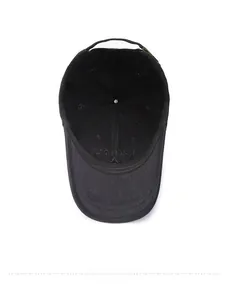 Detail shot of black cotton baseball cap interior showing quality stitching and embroidery
