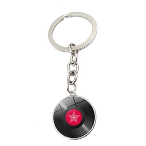 Vintage vinyl record keychain with silver metal ring and pink star emblem on white background