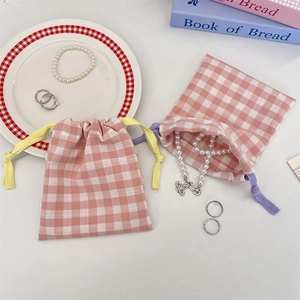 Set of 2 pink and white checkered drawstring storage bags for jewelry and cosmetics