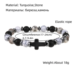 Elastic beaded bracelet with cross charm, featuring matte black and snowflake stones