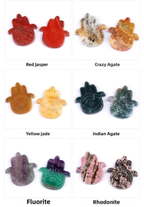 Detailed grid of Hamsa Hand carvings in natural Red Jasper, Agate, Fluorite and Topaz stones
