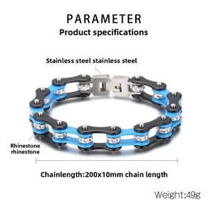 Macro shot of bicycle chain bracelet in black and blue steel with rhinestone inlay