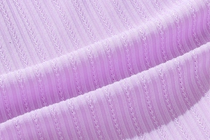 Detailed close-up of lavender purple ribbed thong fabric with intricate breathable patterns