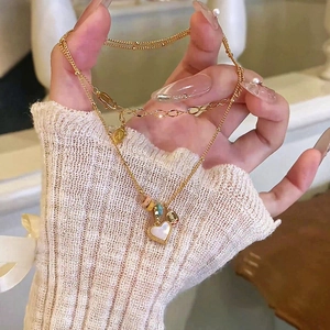 18k gold plated heart necklace with white mother of pearl inlay and colorful beads